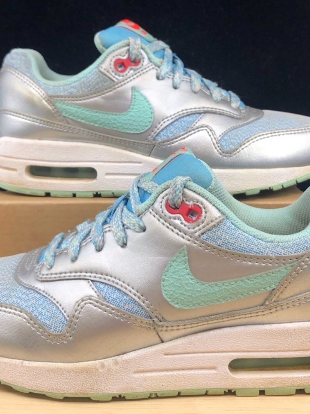 Nike Kids Silver Sneakers with Mint Swoosh and Light Blue Accents